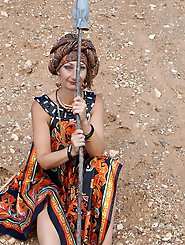 With spear wearing in colorful dress