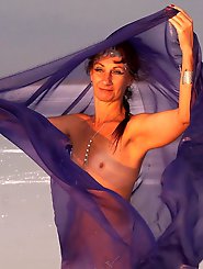 Beautiful sunset scenery by the shore of a salt lake, featuring a blue shawl