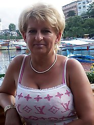 Randy old momma is fingering her slippery holes